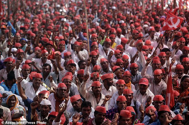Indian farmers shout slogans during a rally at the end of their six day long march on foot, in Mumbai, India, Monday, March 12, 2018. Tens of thousands of farmers from across western India have arrived in Mumbai demanding, among other things, a waiver of farm loans and fair prices for their produce as India's agriculture sector struggles amid years of declining earnings. The farmers reached India's business capital Monday after marching on foot for up to six days and plan to surround the state legislature of the western state of Maharashtra in Mumbai. (AP Photo/Rajanish Kakade)