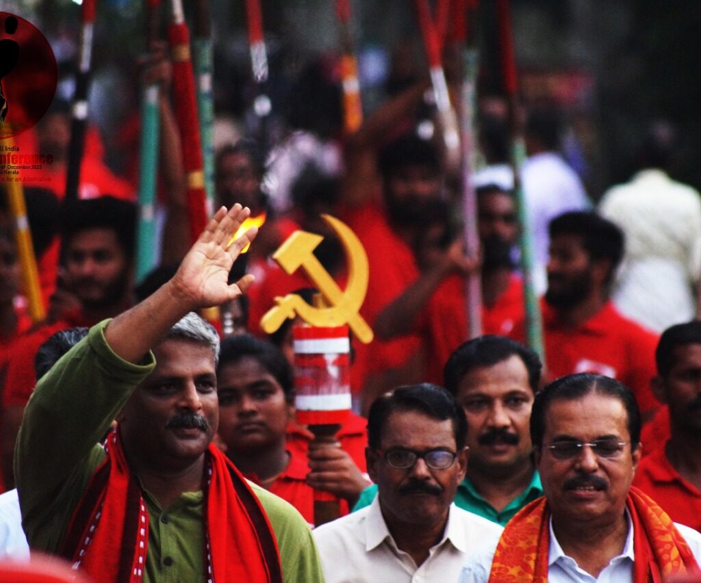 Comrade Vijoo Krishnan, Valsan Panoli And M Vijaykumar Lead The Martyrs Flame Jatha Into Thrissur City. December 12, 2022.